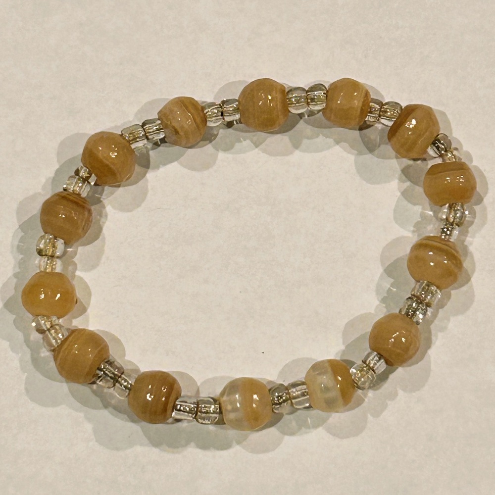 Natural golden colored stone crystal bracelet with elastic rope